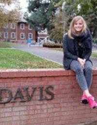 GSP student Ann Kathrin Allekotte poses on UC Davis sign