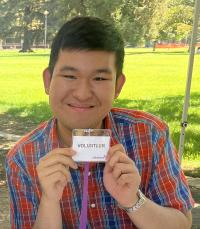 GSP student, Gregory Josefano, poses with his volunteer name tag